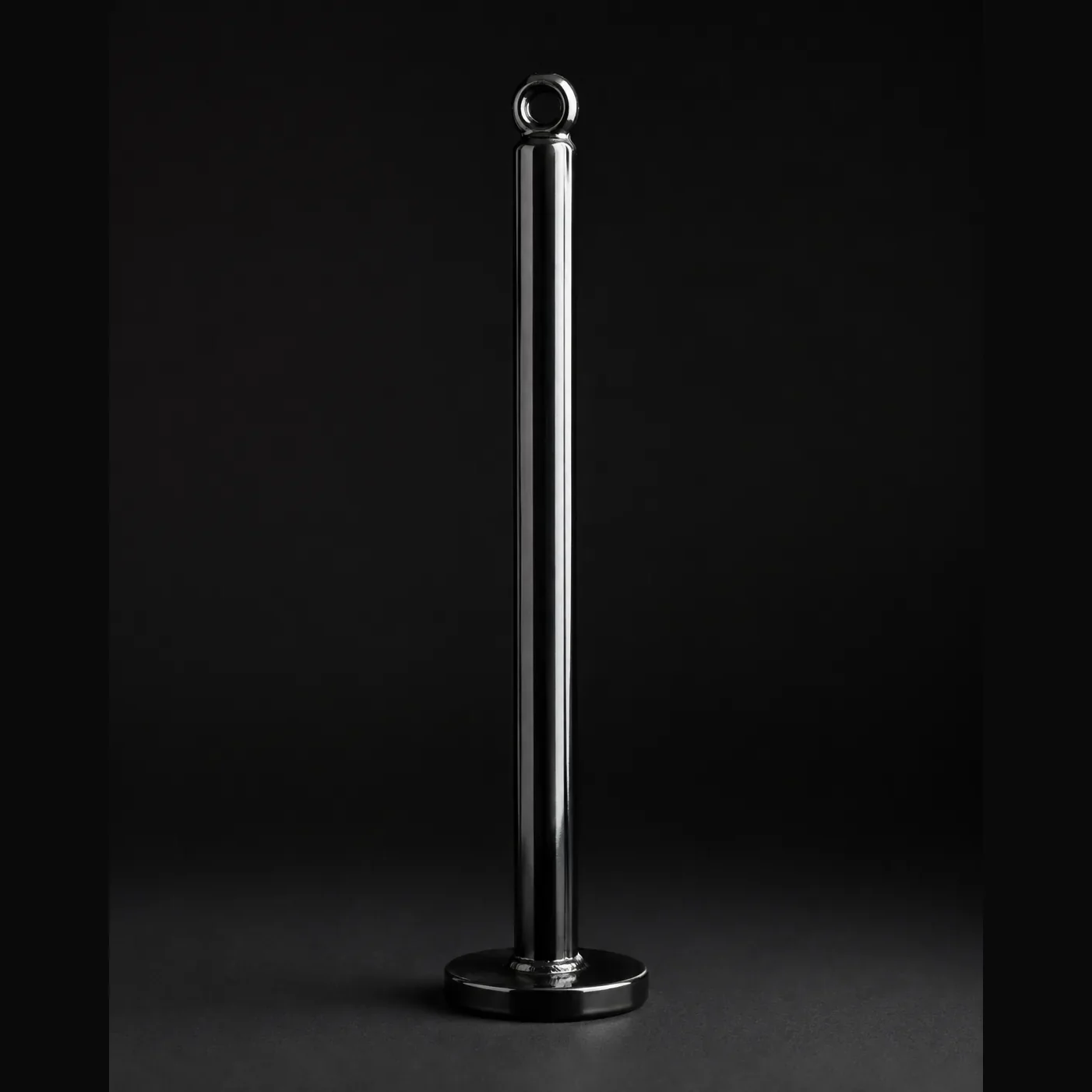 Black steel loading pin standing upright on its flat base